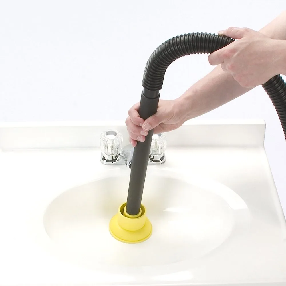 wet dry shop vacuum with its hose over a drain