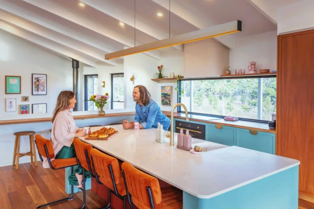 Happy Central Coast family in a modern kitchen with water-efficient fixtures installed by a plumber