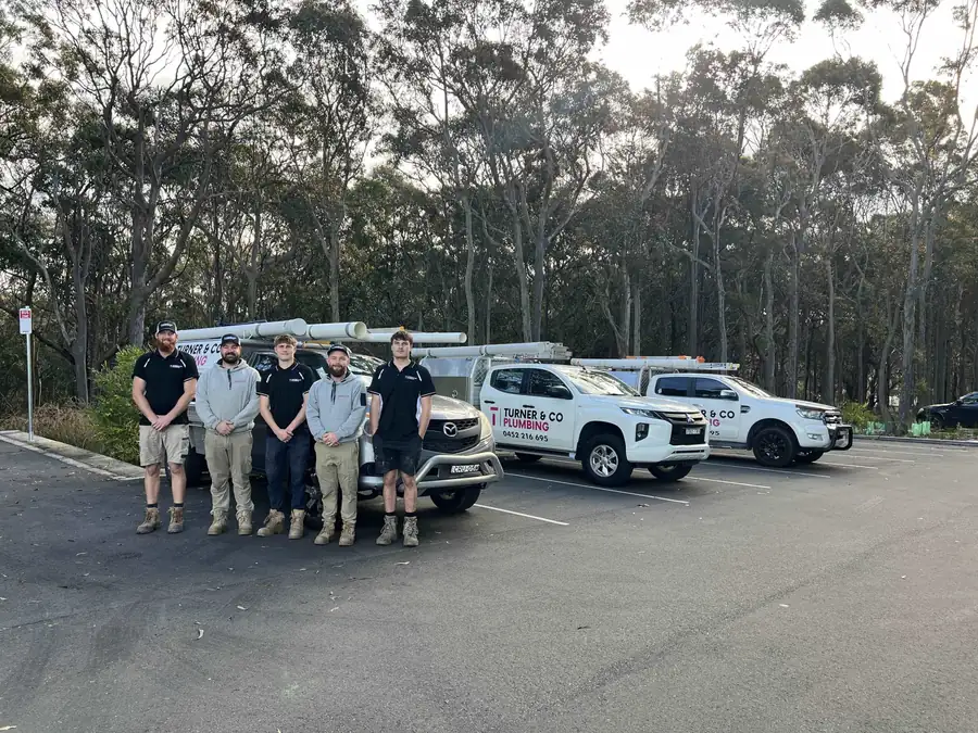 strata and property plumbing team in front of work ute